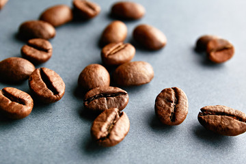 Scattered coffee beans frame design on copy space background.