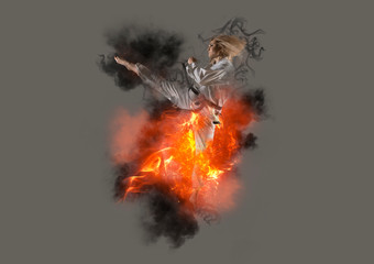 Woman in kimono practicing taekwondo