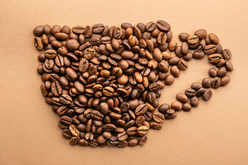Scattered coffee beans frame design on copy space background.
