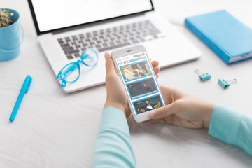 Man holds a tablet and looks at the screen. Mobile development. Innovational online businesses. Internet technologies. Trendy design. Geometry. Fashionable vibrant colors. Using a device. UX and UI.