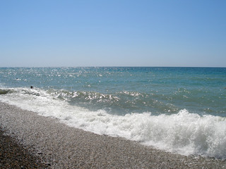 Black Sea on a sunny day. Pebble beach