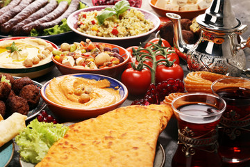 Middle eastern or arabic dishes and assorted meze, concrete rustic background. Falafel. Turkish...