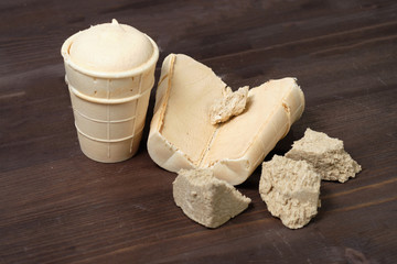 Fototapeta na wymiar ice-cream cream brulee in a waffle on a dack wood background in a cut