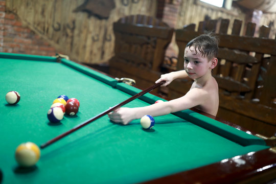 Child Playing Billiards