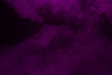 Colorful smoke close-up on a black background