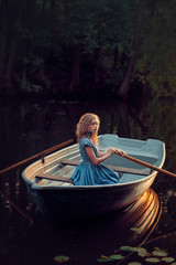 Obraz premium Girl in a boat