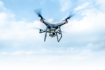 Modern beautiful dark drone in the sky.