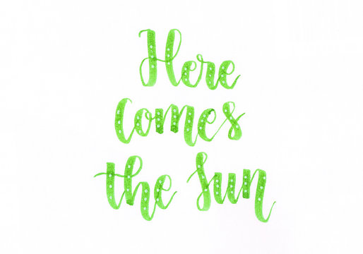Here comes the Sun - green hand lettering inscription in green with white dots