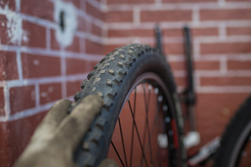 Bicycle mechanic in a workshop in the repair process 