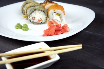 Sushi rolls on a white plate