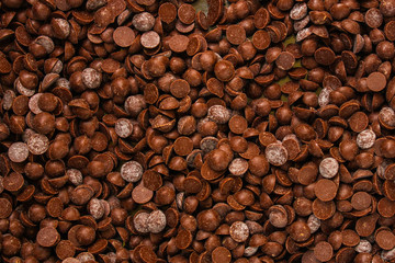 chocolate drops (sweets). food background. copy space. top