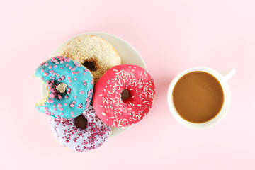 Vibrant composition of lush donut with colorful sprinkled icing, on bright background with a lot of...