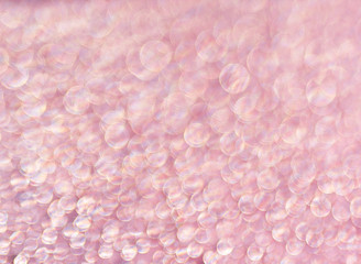 Obraz premium Pink background of shining drops of water