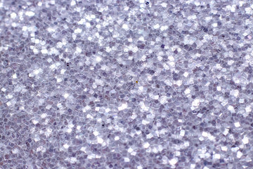 Silver glitter texture. Festive sparkling sequins background. Wpaper for Valentine, New Year or Christmas Holidays