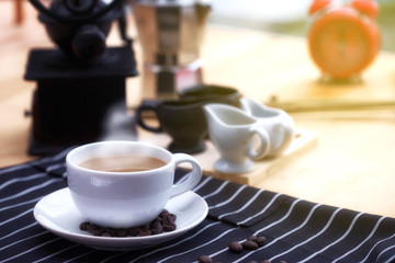 Morning Time. Coffee on the table. coffee beans on table. Smoke on the cup. Early morning home breakfast.