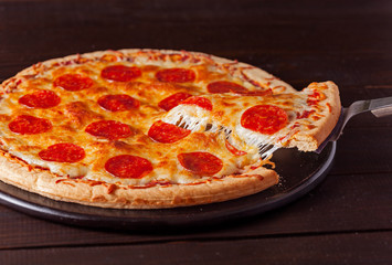 Pepperoni pizza with cheese pull