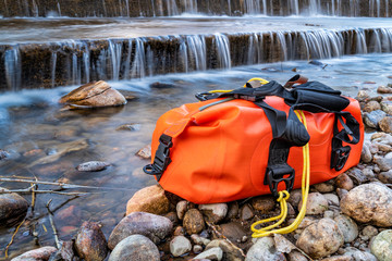 small waterproof duffel on a shore