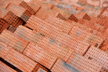 Obraz na płótnie Canvas Background of bricks at a construction site. Bricks at a construction site.