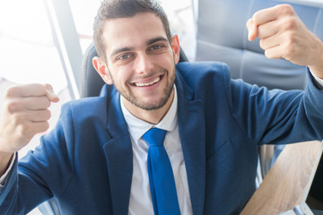 smiling business man celebrating success