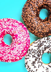 Sweet donuts on black stone table