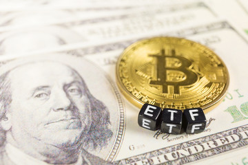 Bitcoin with ETF text on a dollar bills