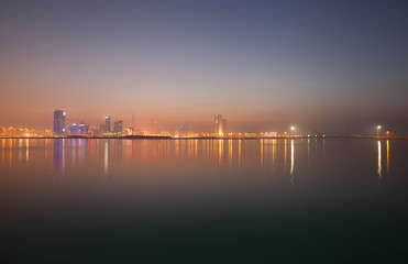 Naklejka premium A beautiful view of Bahrain skyline during evening hours at sunset