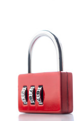 Close up photo of red closed code padlock isolated on white or gray background