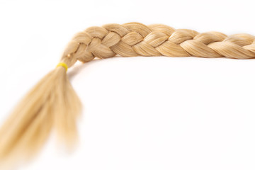 Light blond hair tress on white isolated background. Human, natural hairstyle with copy and free space. Floating border. Fashionable hairstyle for a poster, an advertisement or a hairdressing website.