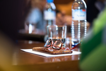 glasses and paper on desk