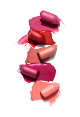 Creative concept photo of cosmetics swatches beauty products lipstick on white background. - obrazy, fototapety, plakaty
