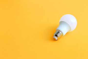energy saving light bulbs on a yellow background the concept of respect for the hardest and saving resources