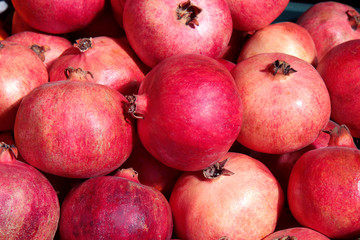 red pomegranates on the market