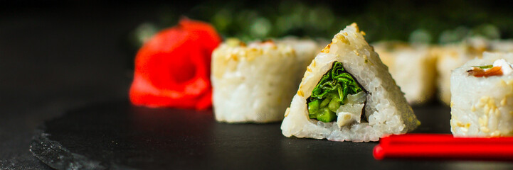 Sushi rolls different taste, rainbow color (fresh seafood) serving. Food background. Top view