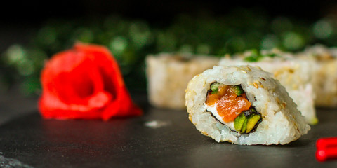Sushi rolls different taste, rainbow color (fresh seafood) serving. Food background. Top view