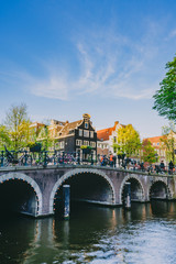 Naklejka premium Amsterdam bridge on sunny day with blue skies in summer