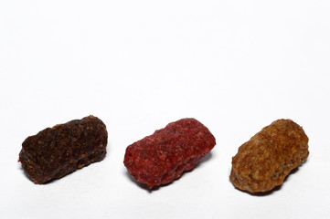 Food dry pieces on a white background for cats, dogs. Balanced pet food.