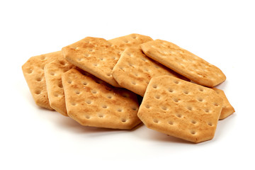 Crispy salted crackers biscuits, close-up, isolated on white background