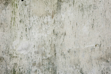 The texture of the wall with scratches and cracks on all sides.