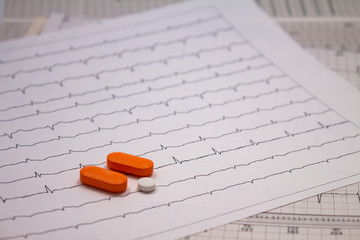 Small drugs for legal use on strips of electrocardiograms.