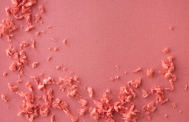 Coral background with small crumbs.