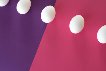 Easter eggs on a pink-purple background.