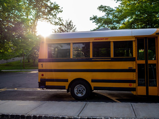 Fototapeta na wymiar yellow school bus at sunset