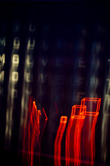 Light blurred pattern where word "mouvement" can be read