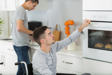 man in wheelchair in the kitchen