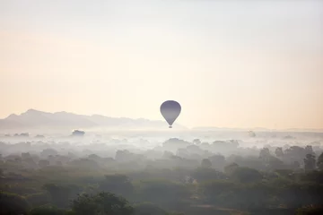 Wall murals Balloon Hot air balloons fly over Bagan