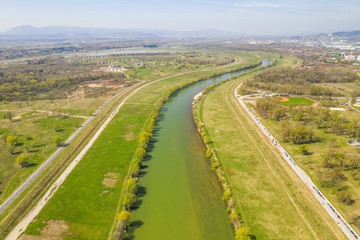 Fototapeta na wymiar Zagreb, Croatia, beautiful green recreation park area, around Sava river and lake Bundek, panoramic view from drone, city in background