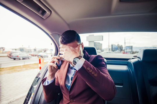 Nervous businessman in a car