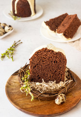Traditional Orthodox Easter sweet bread or cake with chocolate. Chocolate Kulich  decorated with orange glaze.
