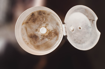 Atmospheric photo preparation of morning coffee in a coffee maker