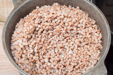 Buckwheat as a source of essential amino acids and ideal products for athletes in a cauldron on the...